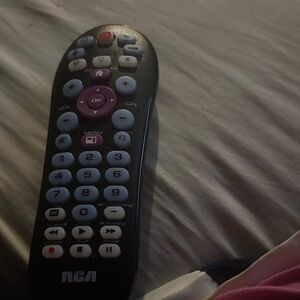 RCA Remote Control with Black and Purple Buttons